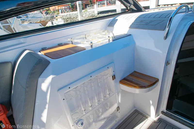 Slide: The Image of Interior of 2023 NX Boats 290 Exclusive Edition, featuring sleek seating and modern design elements. - 26