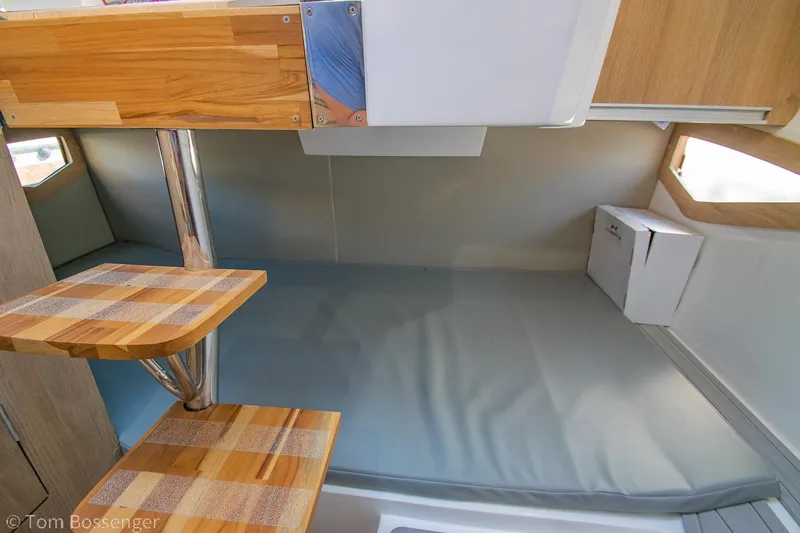 Slide: The Image of Interior of 2023 NX Boats 290 Exclusive Edition, featuring wooden steps and modern design. - 30