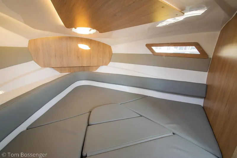 Slide: The Image of 2023 NX Boats 290 Exclusive Edition cabin interior with modern design and comfortable seating. - 34