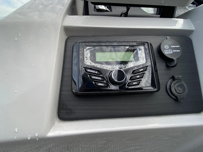 Slide: The Image of Close-up of the 2022 Bennington 22LSR boat's control panel. - 14