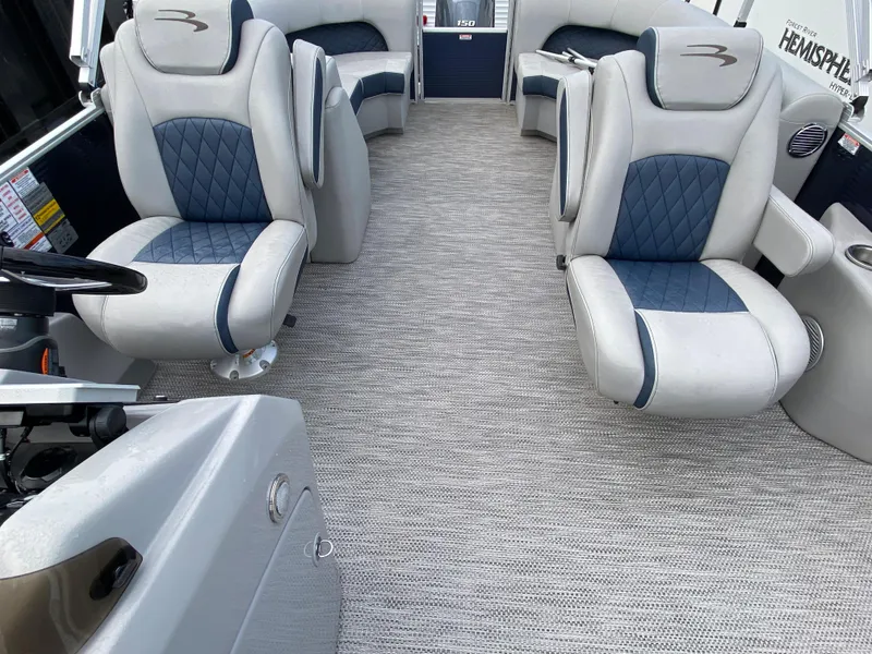 Slide: The Image of 2022 Bennington 22LSR boat interior with plush seating and modern design. - 16