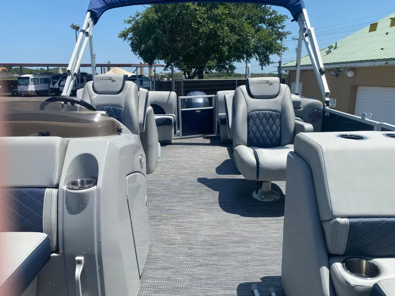 Slide: The Image of 2022 Bennington 22LSR pontoon boat with luxurious seating and modern design. - 21