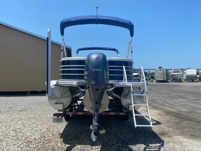 Slide: The Image of 2022 Bennington 22LSR pontoon boat with Yamaha 150 engine, rear view. - 3
