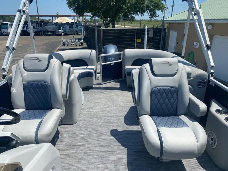 Slide: The Image of 2022 Bennington 22LSR pontoon boat interior with luxurious seating. - 4