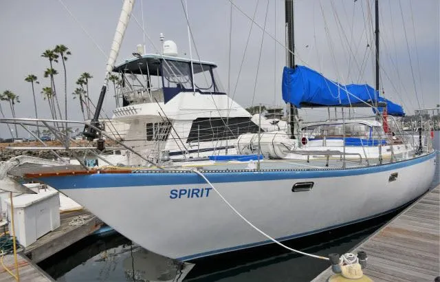 Slide: The Image of 1979 Roberts 54 sailboat named Spirit docked at a marina. - 1