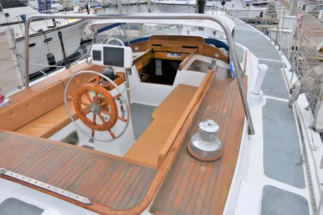 Slide: The Image of 1979 Roberts 54 sailboat cockpit with wooden steering wheel and navigation equipment. - 30