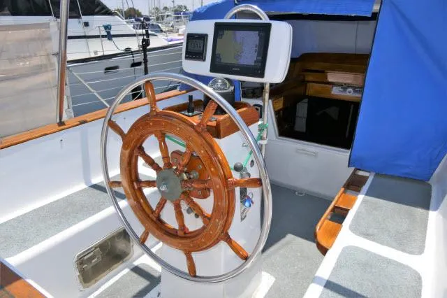 Slide: The Image of Roberts 54 sailboat helm with wooden wheel and navigation system, 1979 model. - 33