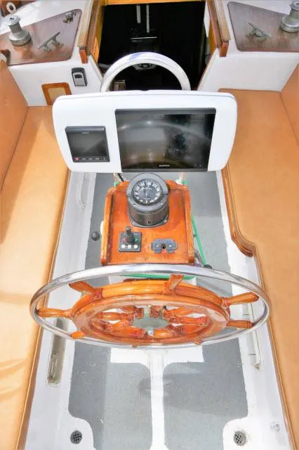 Slide: The Image of Vintage 1979 Roberts 54 boat helm with wooden steering wheel and navigation equipment. - 35