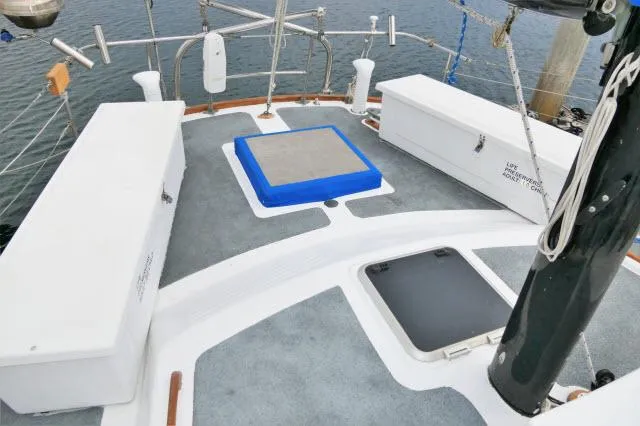 Slide: The Image of Deck of 1979 Roberts 54 sailboat with storage compartments and hatch. - 36
