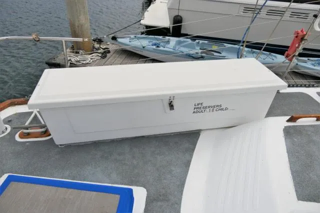 Slide: The Image of White life preserver storage box on a 1979 Roberts 54 boat deck. - 38