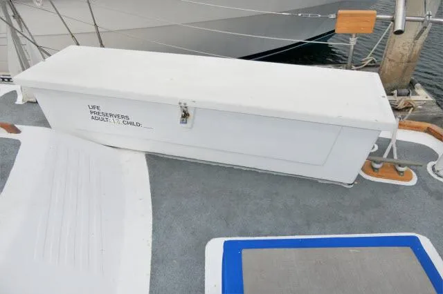 Slide: The Image of White life preserver storage box on deck of 1979 Roberts 54 sailboat. - 39