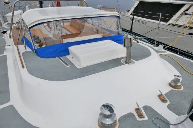 Slide: The Image of 1979 Roberts 54 sailboat deck with cockpit enclosure and winches. - 40