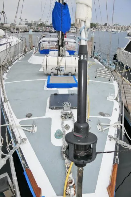 Slide: The Image of 1979 Roberts 54 sailboat docked at a marina. - 47