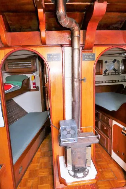 Slide: The Image of Vintage 1979 Roberts 54 boat interior with wood stove and cozy sleeping quarters. - 8