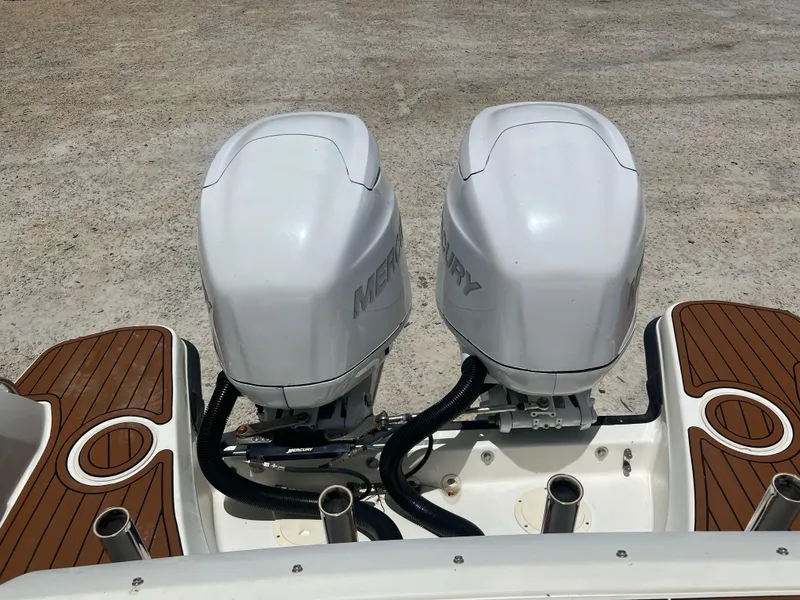 Slide: The Image of Twin Mercury outboard engines on a 2014 Boston Whaler 270 Vantage boat. - 3