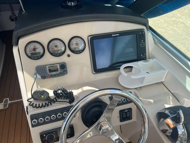 Slide: The Image of Control panel of a 2014 Boston Whaler 270 Vantage boat with gauges and navigation system. - 5
