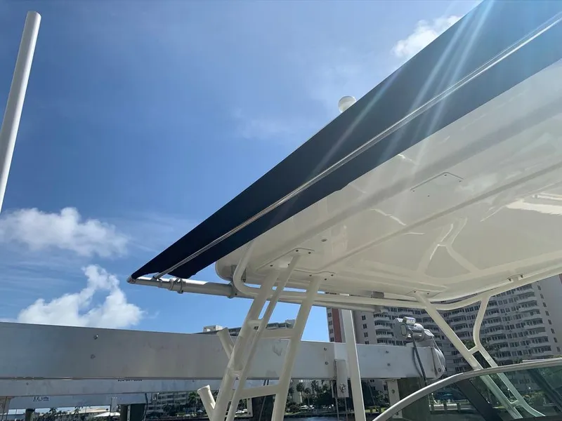 Slide: The Image of Boston Whaler 270 Vantage 2014 boat canopy under clear blue sky. - 7