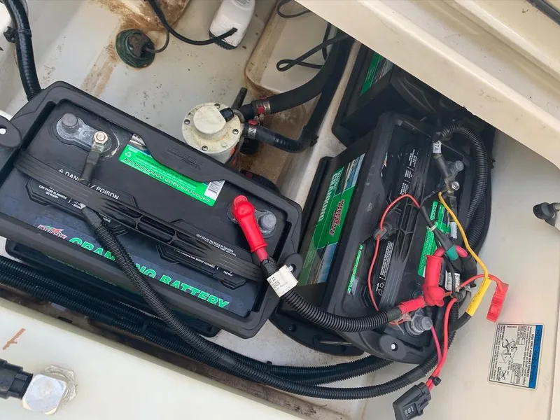 Slide: The Image of Batteries and wiring inside a 2014 Boston Whaler 270 Vantage boat compartment. - 9