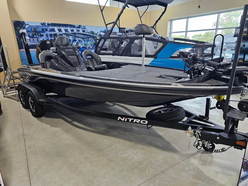 The Image of 2024 Nitro Z19 Pro bass boat displayed in showroom, featuring sleek design and advanced features. - 0
