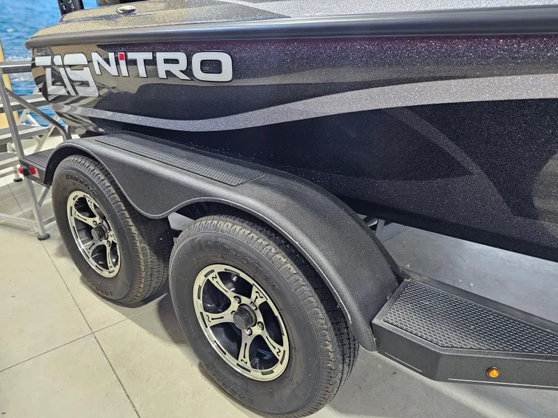 Slide: The Image of 2024 Nitro Z19 Pro boat trailer with dual wheels, black finish, and sleek design. - 9