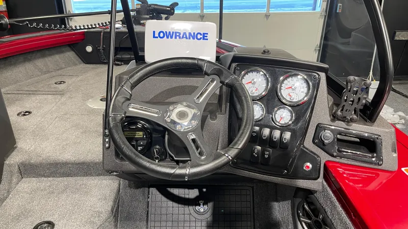 Slide: The Image of 2024 Tracker Targa V-19 Combo dashboard with steering wheel and Lowrance display. - 10