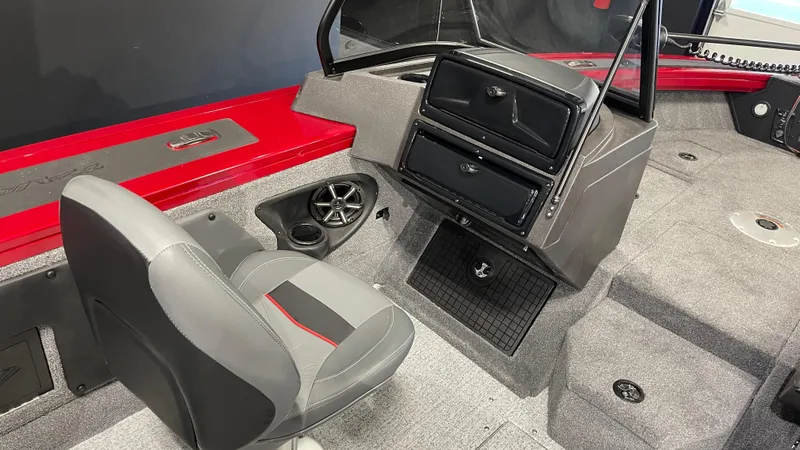 Slide: The Image of 2024 Tracker Targa V-19 Combo boat interior with gray seating and red accents. - 13