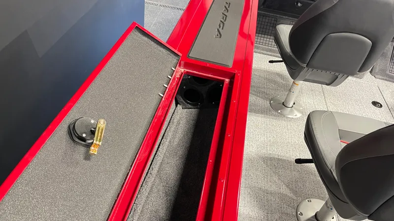 Slide: The Image of 2024 Tracker Targa V-19 Combo interior with storage compartment and seating. - 16