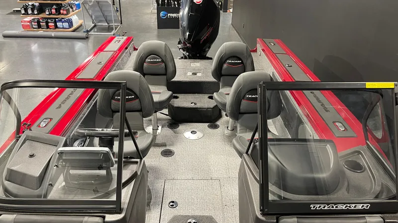 Slide: The Image of 2024 Tracker Targa V-19 Combo boat interior with seating and windshield. - 8