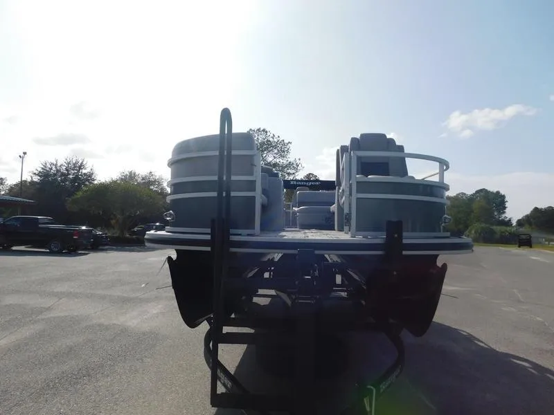 Slide: The Image of 2024 Ranger Reata 223FC pontoon boat on a trailer, rear view. - 4