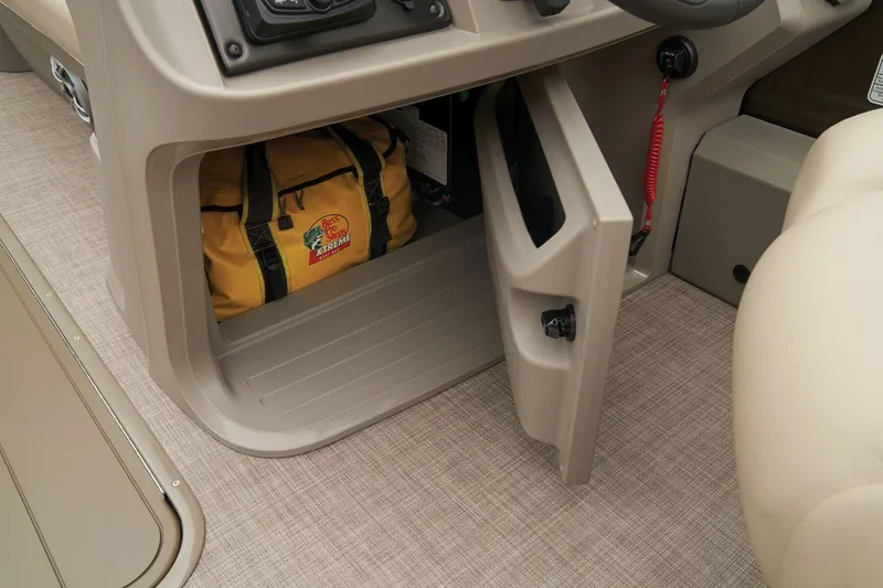 Slide: The Image of Storage compartment in 2024 Sun Tracker SportFish 22 XP3 boat with yellow bag. - 38
