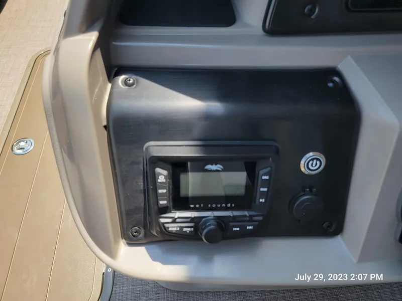 Slide: The Image of Sun Tracker SportFish 22 XP3 2024 boat control panel with audio system. - 3