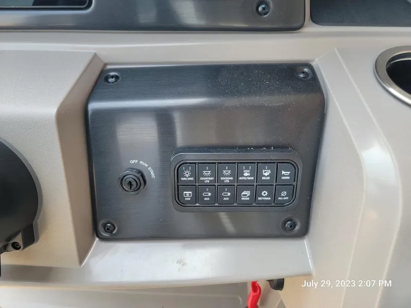 Slide: The Image of 2024 Sun Tracker SportFish 22 XP3 pontoon boat on trailer. - 4