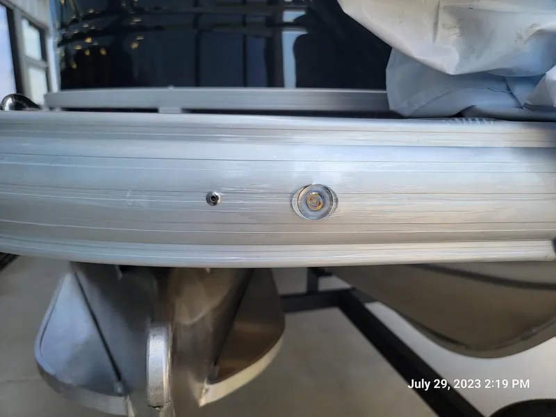 Slide: The Image of 2024 Sun Tracker SportFish 22 XP3 pontoon boat on a trailer. - 5