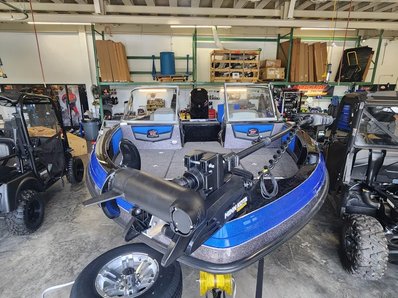 Slide: The Image of 2024 Ranger 1880MS boat in a workshop, equipped with advanced fishing gear. - 2
