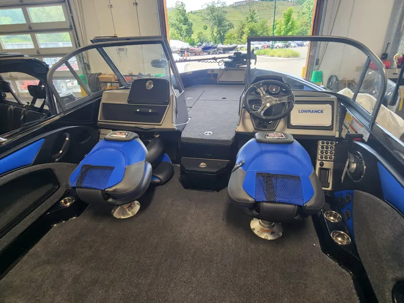 Slide: The Image of 2024 Ranger 1880MS boat interior with blue seats and Lowrance electronics. - 3