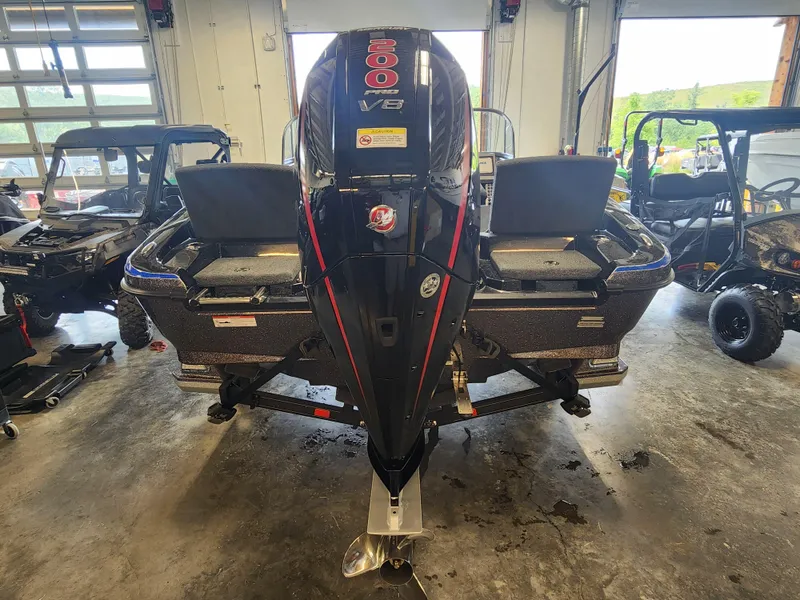 Slide: The Image of 2024 Ranger 1880MS boat with 300 V8 engine in a garage. - 6