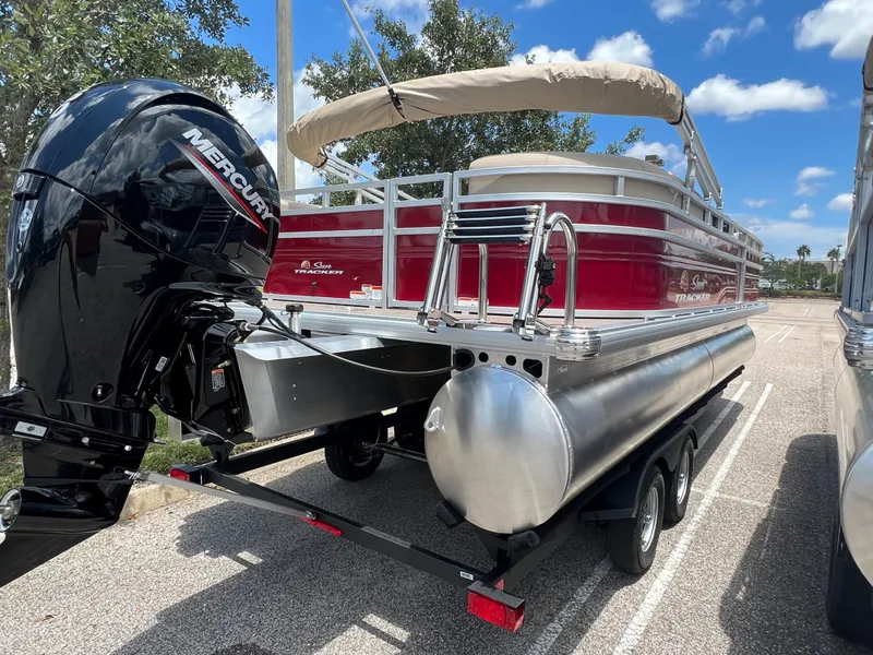 Slide: The Image of 2024 Sun Tracker Party Barge 22 RF DLX pontoon boat with Mercury outboard engine. - 4