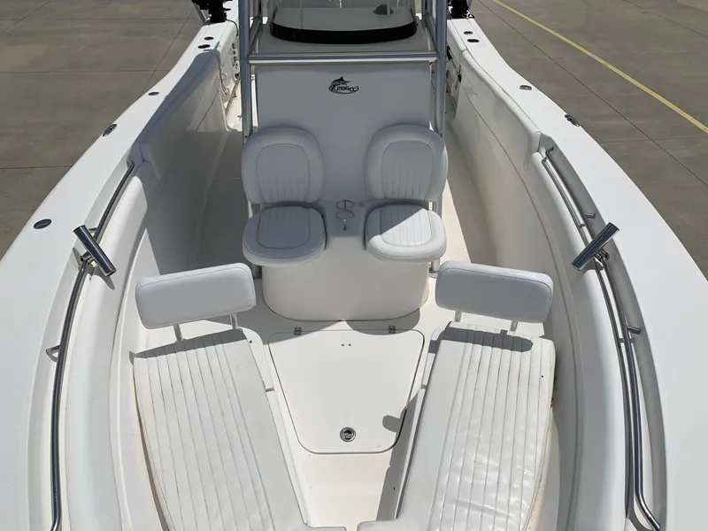 Slide: The Image of 2013 Sea Fox 286 CC boat interior with white seating and console. - 5