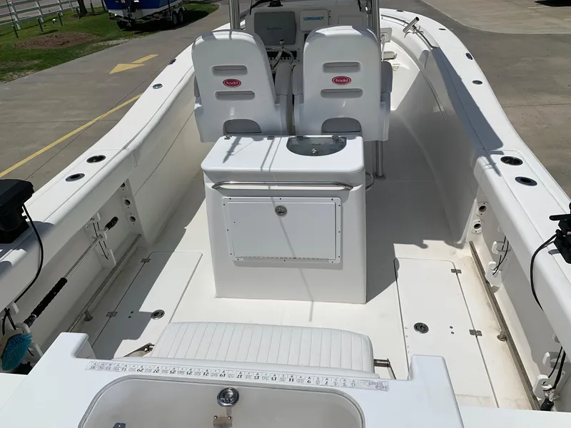 Slide: The Image of 2013 Sea Fox 286 CC center console boat interior with seating and storage. - 6
