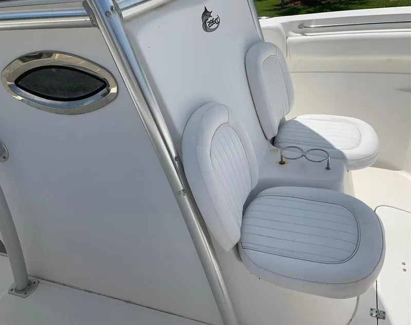 Slide: The Image of 2013 Sea Fox 286 CC boat with white cushioned seats and stainless steel accents. - 16