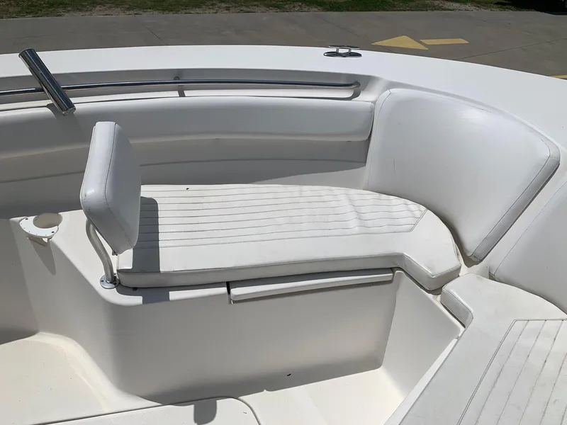 Slide: The Image of 2013 Sea Fox 286 CC boat with white cushioned seating. - 17