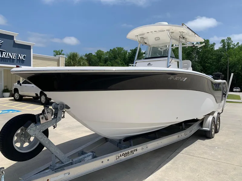 Slide: The Image of 2013 Sea Fox 286 CC boat on trailer in front of Marine NC building. - 2