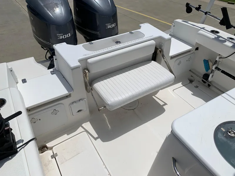 Slide: The Image of 2013 Sea Fox 286 CC boat with twin Yamaha 300 engines and foldable rear seat. - 12