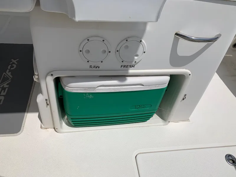 Slide: The Image of Sea Fox 286 CC 2013 boat with cooler storage and raw/fresh water controls. - 18