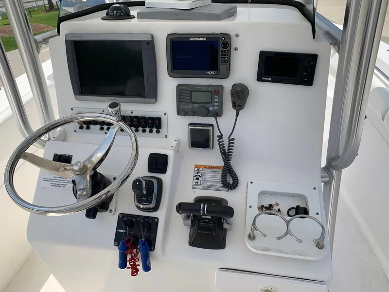 Slide: The Image of 2013 Sea Fox 286 CC boat console with steering wheel, navigation, and control systems. - 7