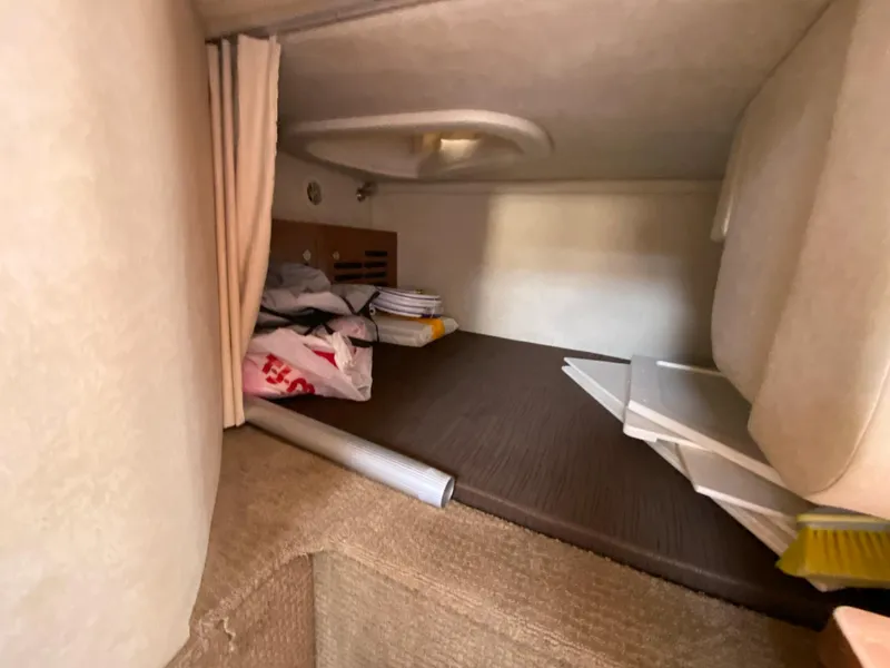 Slide: The Image of Interior cabin storage area of 2013 Sea Ray 310 Sundancer boat. - 17