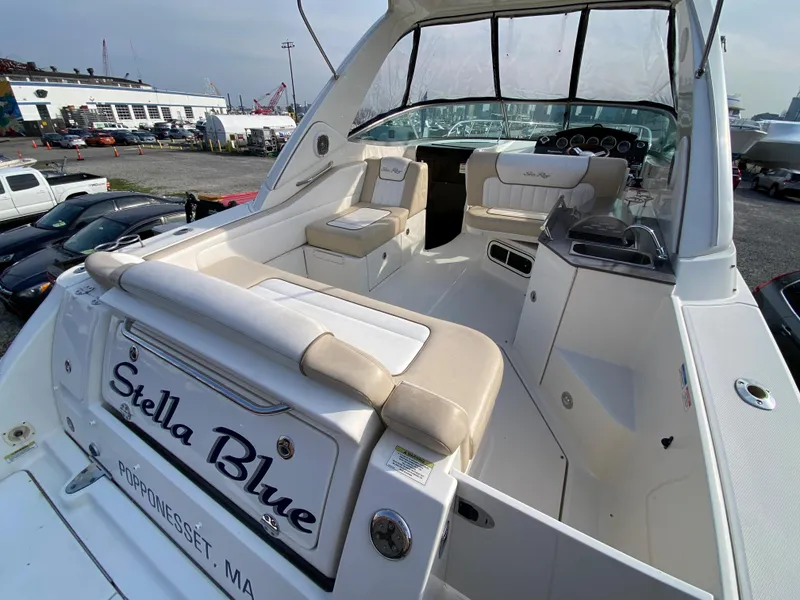 Slide: The Image of 2013 Sea Ray 310 Sundancer boat with spacious seating and elegant design. - 7