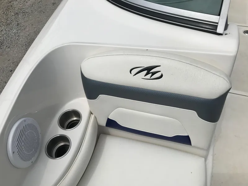 Slide: The Image of 2010 Monterey 214FS boat seat with cup holders and speaker. - 16