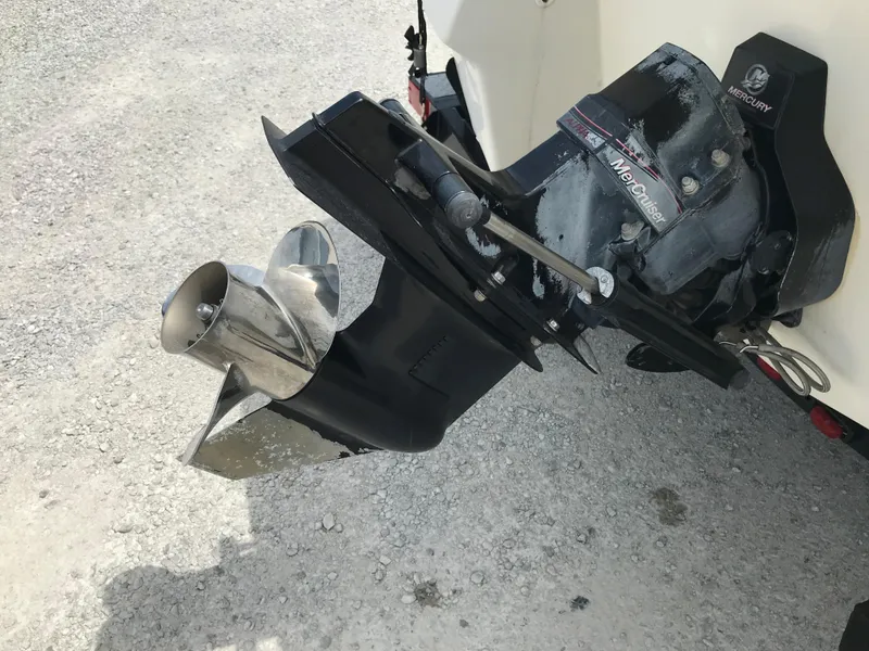 Slide: The Image of 2010 Monterey 214FS boat outdrive and propeller on gravel surface. - 6