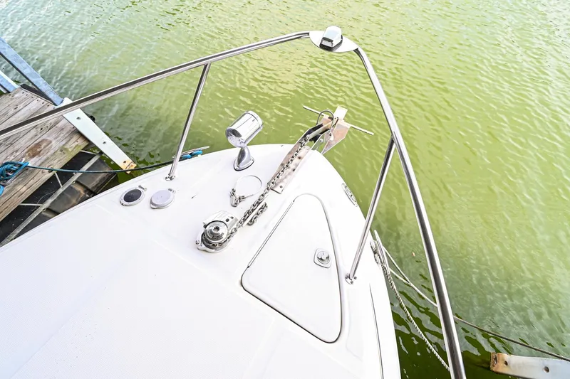 Slide: The Image of 2001 Sea Ray 260 Sundancer bow view at dock. - 19